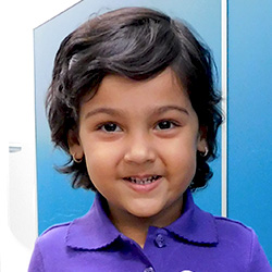 little girl smiling at school